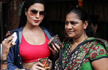 Veena Malik promotes Zindagi 50-50 by distributing condoms in Kamathipura